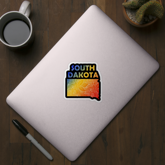 Colorful mandala art map of South Dakota with text in blue, yellow, and red by Happy Citizen